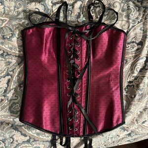 Red corset medium with adjustable hooks in back and lace up front.